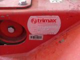a close up of a red machine with a label on it