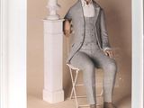 a picture of a man sitting in a chair next to a bust of a man