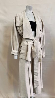 an image of a mannequin wearing a coat and skirt