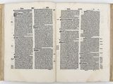 an open book with a page of text on it on a white surface