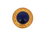 a close up of a gold and lapel pin with a blue stone