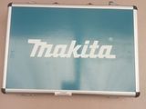 a picture of a picture of a makita sign on a wall