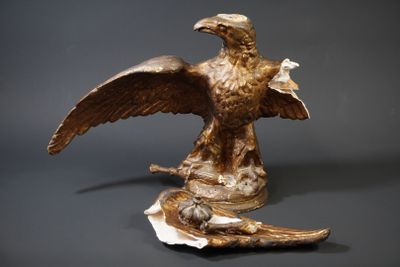 a statue of an eagle with a bird on it ' s back