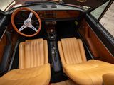 dashboard of a car with leather seats and a steering wheel