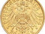 a close up of a gold coin with an eagle on it