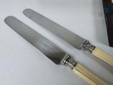 two knives that are sitting next to each other on a table