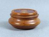 a small wooden box with a lid on a table