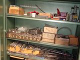 a green cabinet with lots of items on top of it