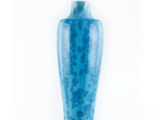 a blue vase that is sitting on a white surface