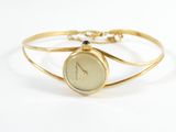 a close up of a wrist watch on a gold bracelet
