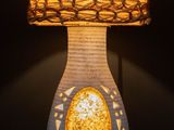 a lamp that is sitting on a table with a lamp on it