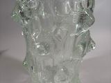 a glass vase that is sitting on a table