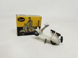 a small toy scooter with a box on the table