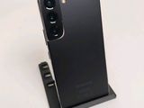 the back of a black phone with a camera attached to it