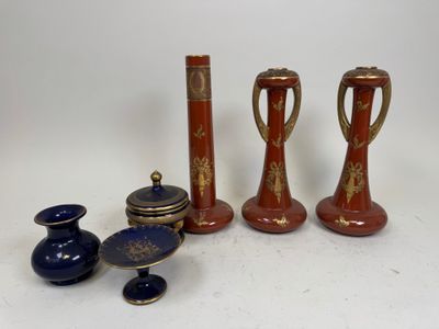 several different types of vases are sitting on a white surface