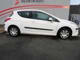 a picture of a white car parked in front of a building