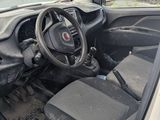 a small car with the door open and a steering wheel in it
