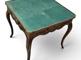 an old table with a green glass top on a white background