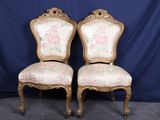 paire de chaises anciennes avec dossier rembourré à motifs floraux