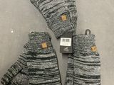 a pair of gloves sitting on top of a table next to each other