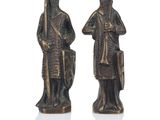pair of bronze figurines of a man and a woman