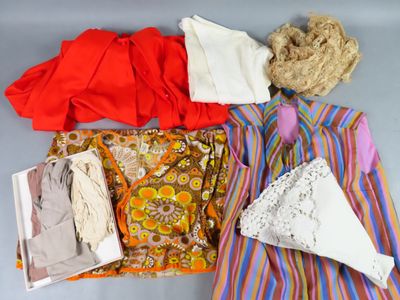 a pile of clothes and a bag on a table