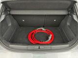 a red hose in the trunk of a car