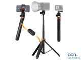 a close up of a camera and a tripod on a white background