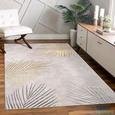 a rug that has a palm leaf design on it