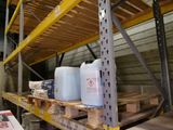 two plastic containers sitting on a pallet in a warehouse
