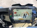 a close up of a motorcycle ' s gps device on the handlebar