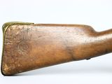 a close up of a rifle on a white surface with a white background