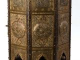 a very ornate wooden cabinet with intricate carvings on it