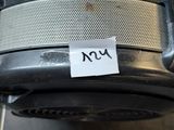 an image of a close up of a black and silver chair with a sticker on it