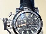 a close up of a watch on display on a table