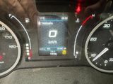 dashboard view of a car with a digital display on the dashboard