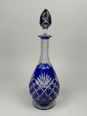 an image of a blue glass bottle on a white background