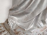 a statue of a woman sitting on top of a table