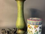 two vases and a box sitting on a table