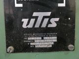 a sign on the side of a machine that says utts