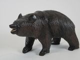 a black bear figurine on a white background