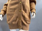 an image of a mannequin mannequin wearing a brown cardigan sweater