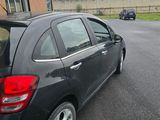 a black car parked in front of a building