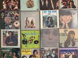 a lot of music cds and cds on the wall