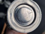 a close up of a person holding a metal object