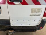 a white truck with a red stripe on the back of it