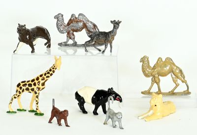 a lot of different animal figurines on a white surface