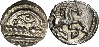 a silver coin with an image of a man on a horse