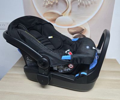 a baby car seat that is sitting on a table