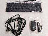 an image of a computer keyboard and mouse in a bag